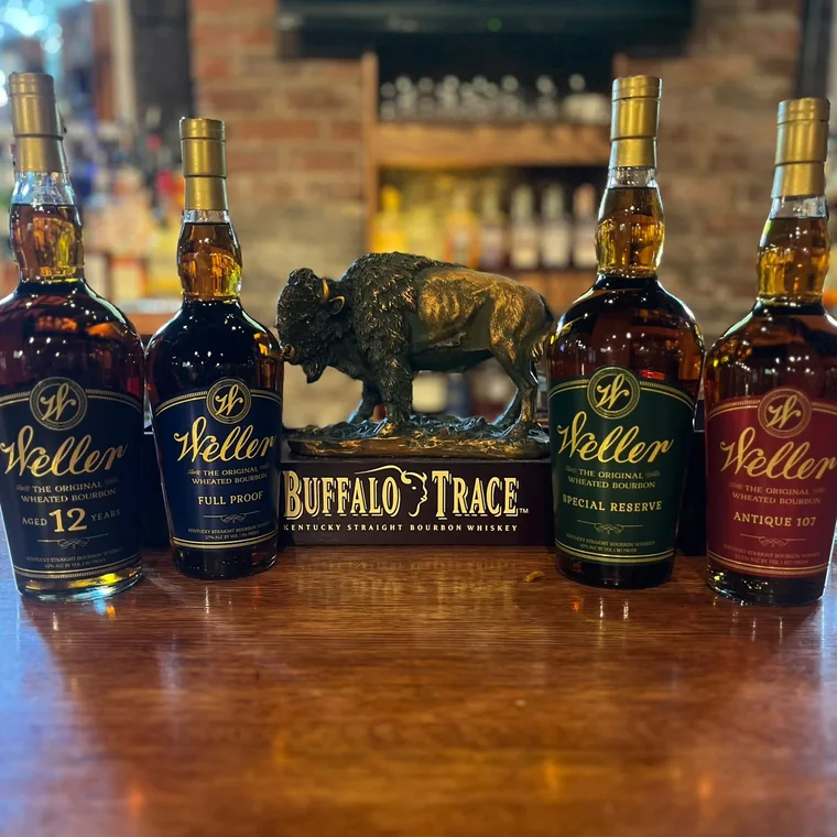 Weller bourbons lined up on the bar around the Buffalo Trace bison