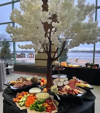 A catered spread of meats, cheeses, fruit and vegetables